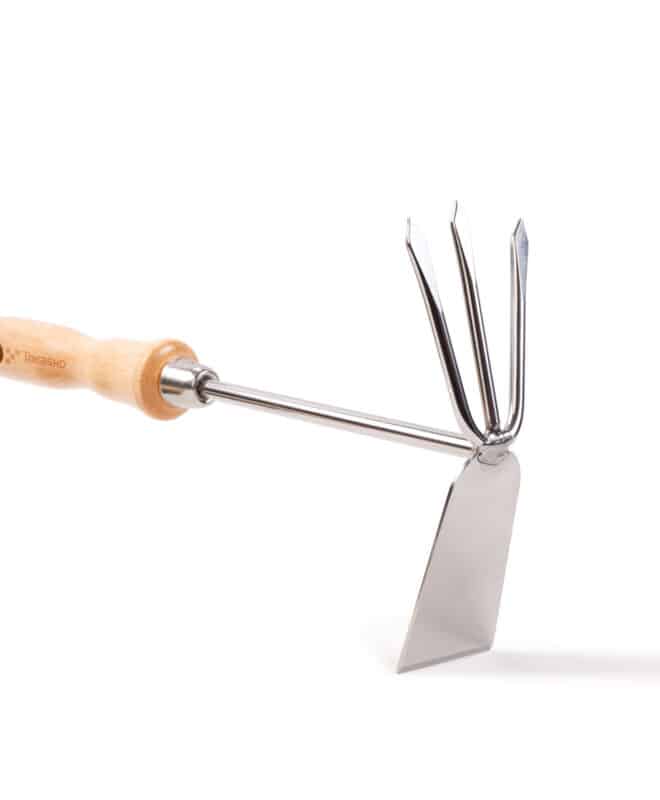 Photo of a garden tool; wooden handle with two functional heads - one hoe and one three pronged fork